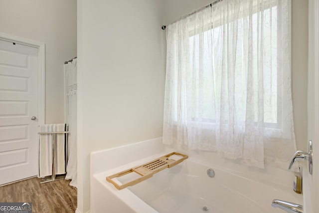 133 Coldwater Ln, Griffin, GA 30224 - full bath featuring a bathtub and wood finished floors