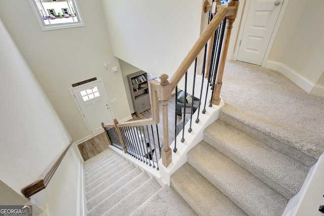 133 Coldwater Ln, Griffin, GA 30224 - stairs with carpet and a towering ceiling
