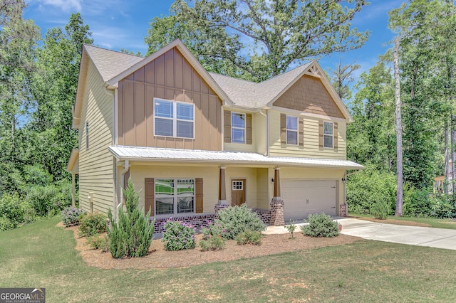 133 Coldwater Ln, Griffin, GA 30224 - craftsman house featuring board and batten siding, a garage, a porch, driveway, and a front lawn