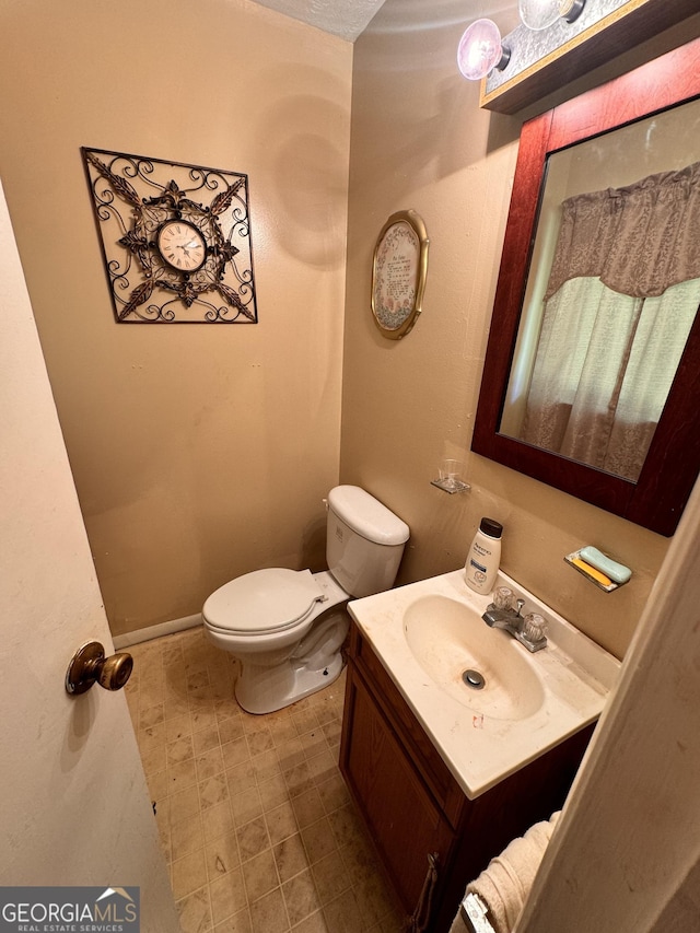 2019 Cason Dr, Vidalia, GA 30474 - bathroom featuring toilet and vanity