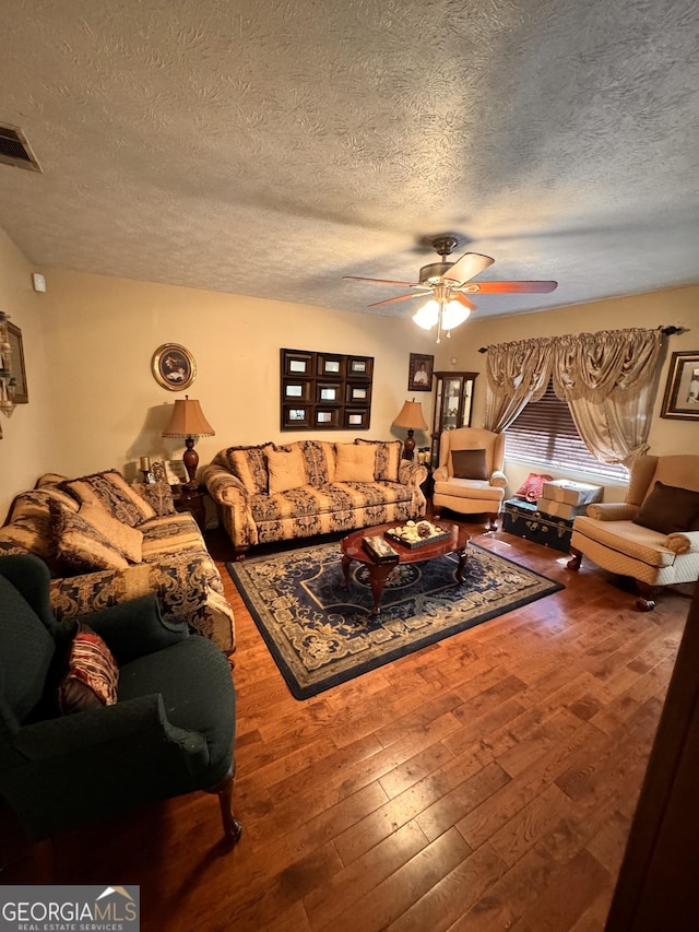 2019 Cason Dr, Vidalia, GA 30474 - living room with a textured ceiling, ceiling fan, and hardwood / wood-style floors