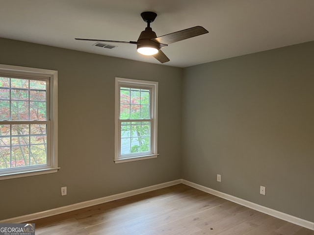 730 Redlion Run, Alpharetta, GA 30022 - unfurnished room with light wood finished floors, baseboards, and a ceiling fan