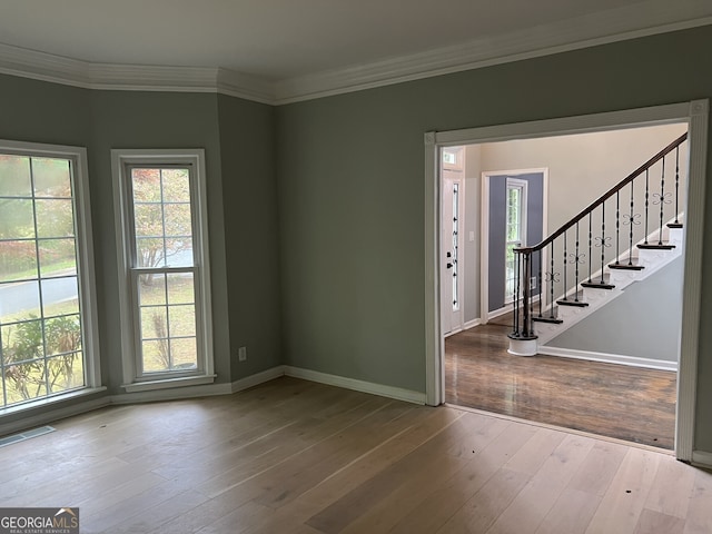730 Redlion Run, Alpharetta, GA 30022 - empty room with healthy amount of natural light, wood-type flooring, and ornamental molding