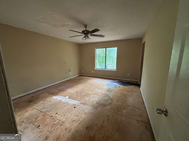 1090 Forest Path, Stone Mountain, GA 30088 - spare room with baseboards and ceiling fan