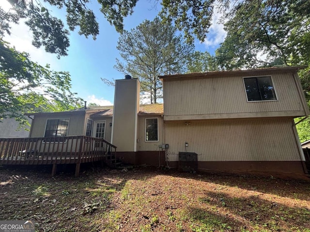 1090 Forest Path, Stone Mountain, GA 30088 - back of house featuring a deck and a chimney