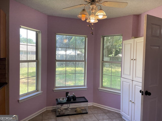 102 Driftwood Ct, Kingsland, GA 31548 - dining space with a ceiling fan, light tile patterned floors, a textured ceiling, and baseboards