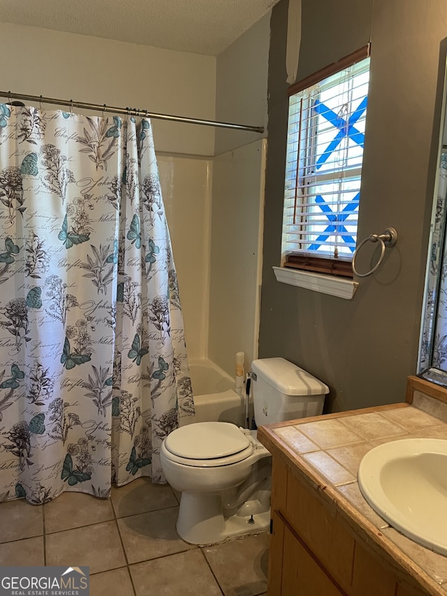 102 Driftwood Ct, Kingsland, GA 31548 - full bathroom with vanity, tile patterned flooring, toilet, shower / tub combo with curtain, and a textured ceiling