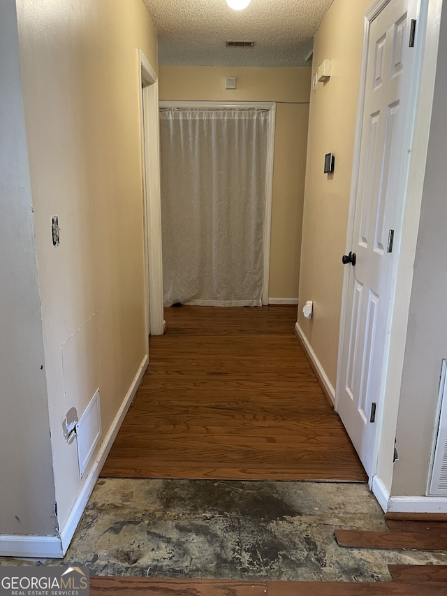 102 Driftwood Ct, Kingsland, GA 31548 - hall with wood finished floors, baseboards, and a textured ceiling