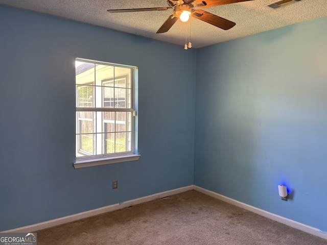 102 Driftwood Ct, Kingsland, GA 31548 - carpeted empty room with plenty of natural light, ceiling fan, a textured ceiling, and baseboards