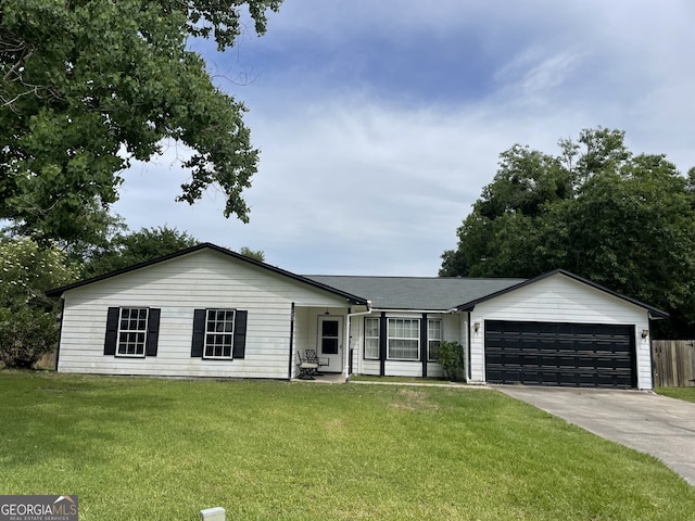 102 Driftwood Ct, Kingsland, GA 31548 - ranch-style house featuring a garage, driveway, and a front lawn