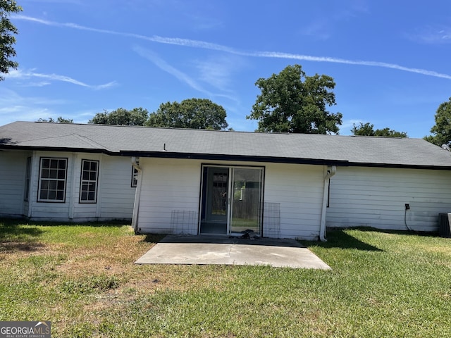 102 Driftwood Ct, Kingsland, GA 31548 - back of house with a patio, a yard, and central air condition unit