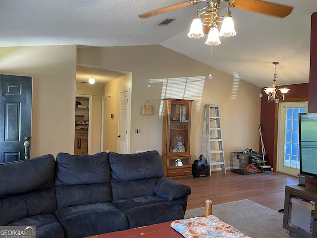 102 Driftwood Ct, Kingsland, GA 31548 - living room featuring wood finished floors, ceiling fan, lofted ceiling, and a chandelier
