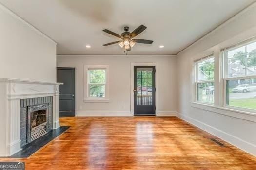 2 E 10th St SW, Rome, GA 30161 - unfurnished living room featuring ceiling fan, wood finished floors, a fireplace, baseboards, and recessed lighting