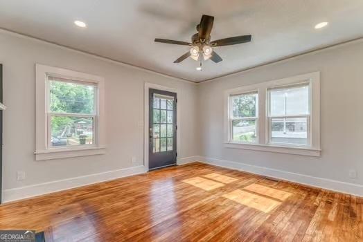 2 E 10th St SW, Rome, GA 30161 - unfurnished room with baseboards, wood finished floors, a ceiling fan, and recessed lighting