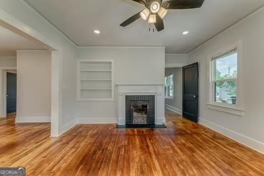 2 E 10th St SW, Rome, GA 30161 - unfurnished living room featuring built in features, baseboards, and a ceiling fan