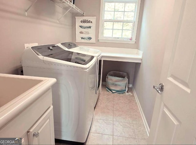 779 Avonley Creek Trce, Buford, GA 30518 - laundry area featuring washer and clothes dryer, cabinet space, and light tile patterned flooring