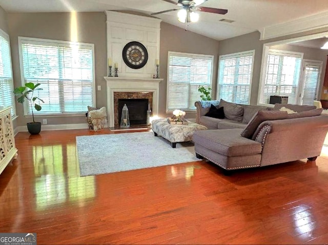 779 Avonley Creek Trce, Buford, GA 30518 - living area with ceiling fan, wood finished floors, lofted ceiling, and a high end fireplace