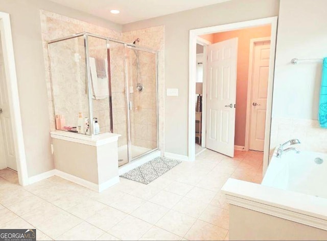 779 Avonley Creek Trce, Buford, GA 30518 - bathroom featuring a stall shower, a bath, and tile patterned flooring