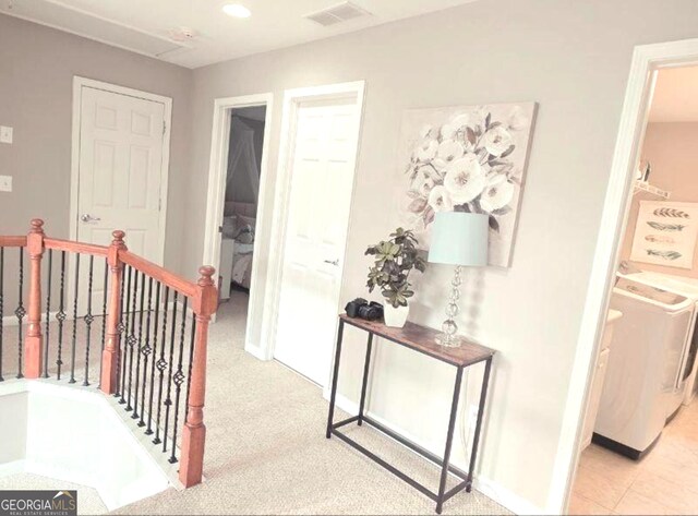 779 Avonley Creek Trce, Buford, GA 30518 - corridor featuring an upstairs landing, light colored carpet, washer and clothes dryer, and recessed lighting