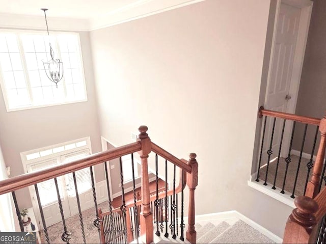 779 Avonley Creek Trce, Buford, GA 30518 - staircase featuring a chandelier and carpet flooring