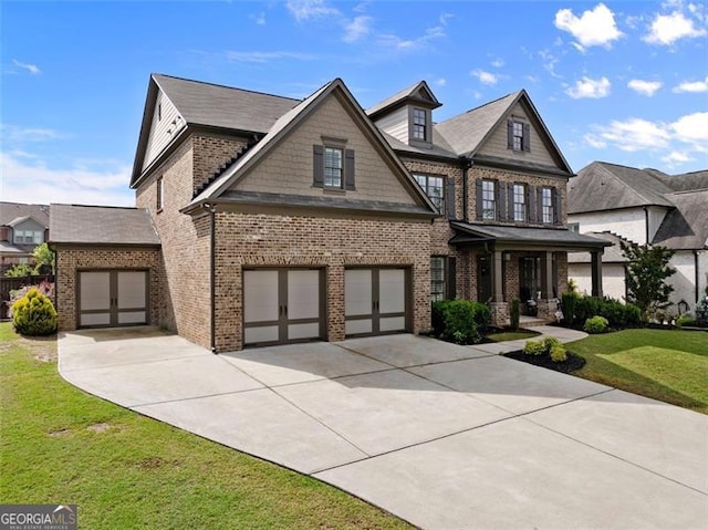 3317 Sweetleaf Ln, Buford, GA 30519 - craftsman house featuring brick siding, concrete driveway, a front lawn, and an attached garage