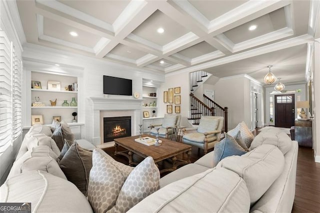 3317 Sweetleaf Ln, Buford, GA 30519 - living room with wood finished floors, stairway, a warm lit fireplace, beamed ceiling, and coffered ceiling