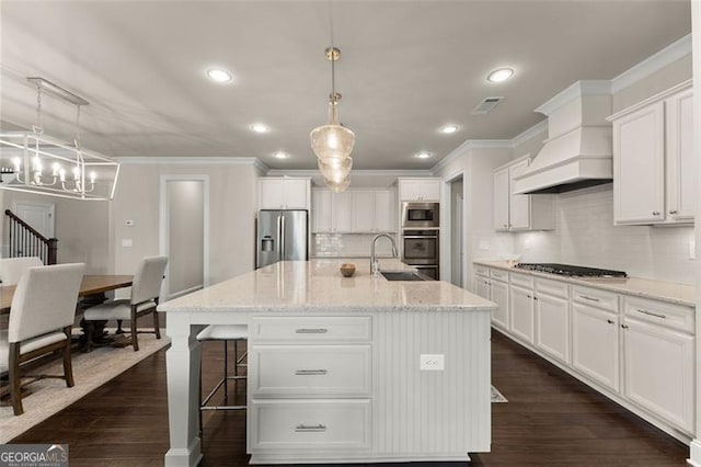 3317 Sweetleaf Ln, Buford, GA 30519 - kitchen featuring stainless steel appliances, a sink, ornamental molding, white cabinetry, and backsplash