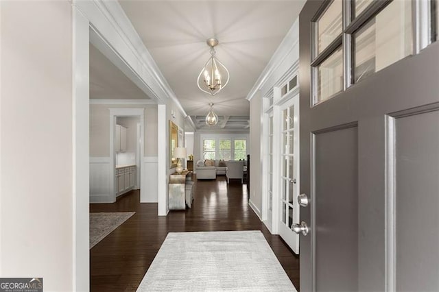 3317 Sweetleaf Ln, Buford, GA 30519 - entryway featuring a chandelier, dark wood finished floors, ornamental molding, french doors, and a wainscoted wall