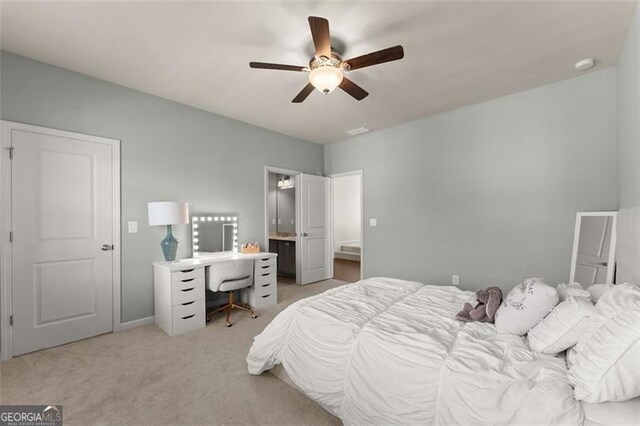 3317 Sweetleaf Ln, Buford, GA 30519 - bedroom with light carpet, an office area, ensuite bath, and a ceiling fan