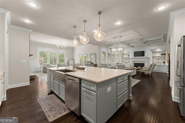 3317 Sweetleaf Ln, Buford, GA 30519 - kitchen featuring appliances with stainless steel finishes, gray cabinetry, a sink, a chandelier, and ornamental molding