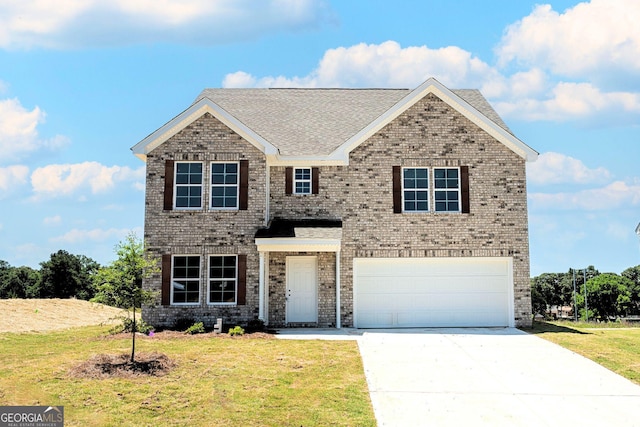 406 Clayton Scott St, Warner Robins, GA 31088 - traditional-style home featuring brick siding, a front yard, a garage, and concrete driveway