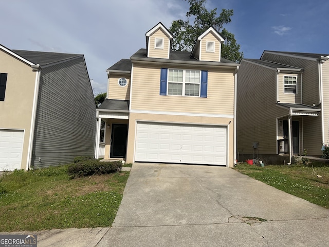 1263 Brookstone Rd, Atlanta, GA 30349 - traditional-style house featuring driveway, an attached garage, and a front yard