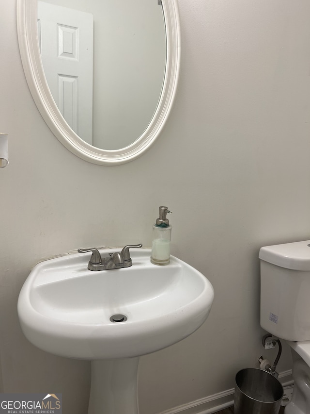 1263 Brookstone Rd, Atlanta, GA 30349 - bathroom featuring a sink and toilet