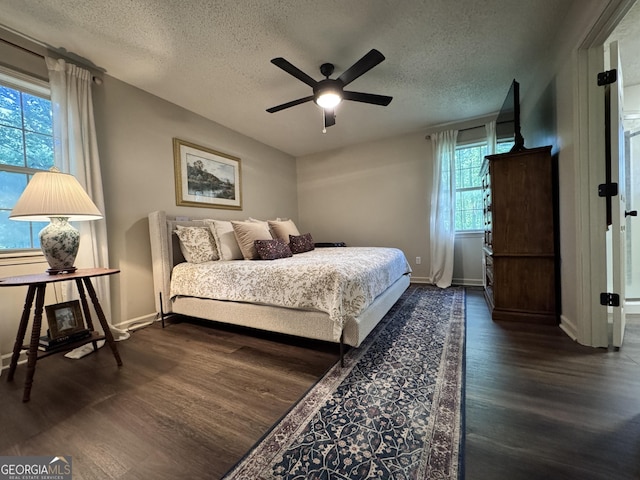 353 Lewis Cir, Commerce, GA 30529 - bedroom featuring wood finished floors, a textured ceiling, baseboards, and a ceiling fan