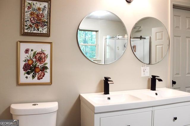 353 Lewis Cir, Commerce, GA 30529 - bathroom featuring toilet, double vanity, and a shower