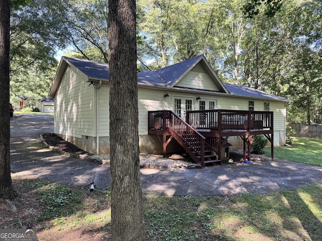 353 Lewis Cir, Commerce, GA 30529 - back of house featuring french doors, a deck, and stairway