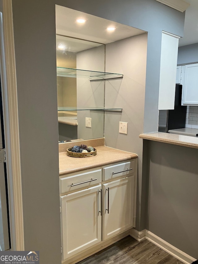 2119 Pine Heights Dr NE, Atlanta, GA 30324 - bar with freestanding refrigerator, dark wood finished floors, tasteful backsplash, and baseboards