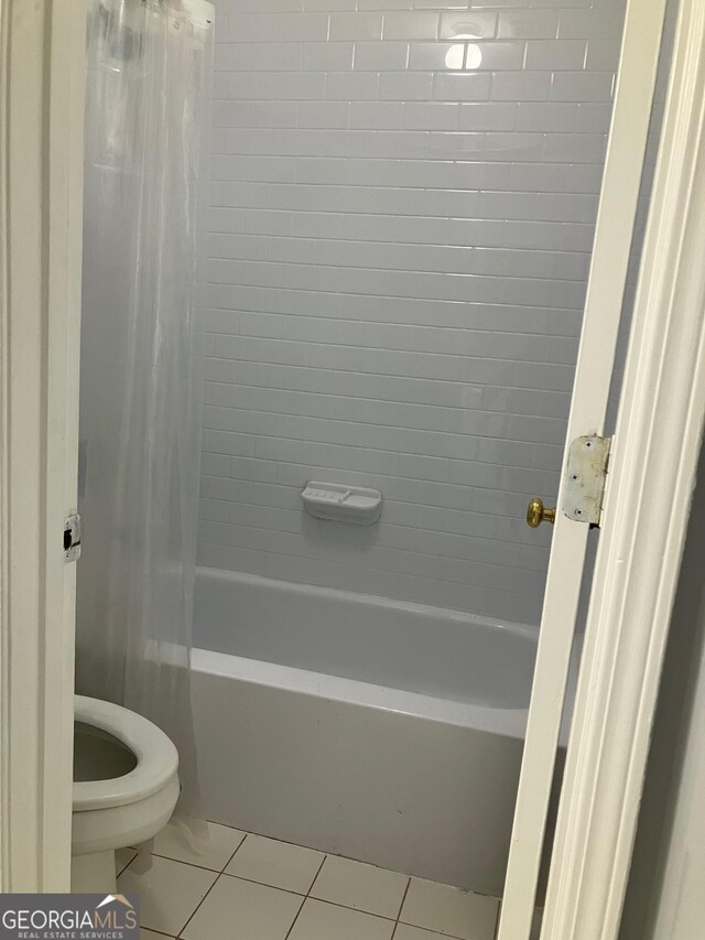 2119 Pine Heights Dr NE, Atlanta, GA 30324 - full bathroom with tile patterned flooring, shower / tub combo with curtain, and toilet