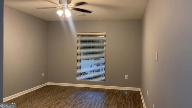 2119 Pine Heights Dr NE, Atlanta, GA 30324 - spare room featuring dark wood-style floors, baseboards, and ceiling fan