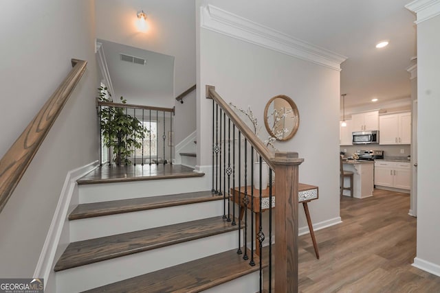 2861 Fareed Unit 40, Douglasville, GA 30135 - stairs featuring ornamental molding, wood finished floors, recessed lighting, and baseboards