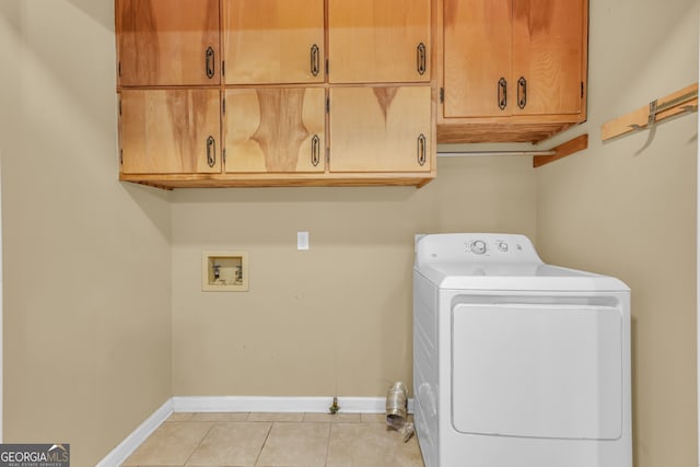 4911 Old Douglasville Rd, Lithia Springs, GA 30122 - laundry area with washer / dryer, cabinet space, light tile patterned floors, and baseboards