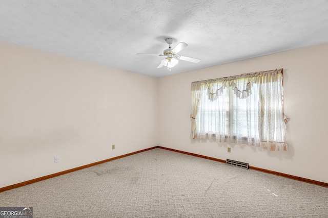 4911 Old Douglasville Rd, Lithia Springs, GA 30122 - spare room with a ceiling fan, baseboards, carpet flooring, and a textured ceiling