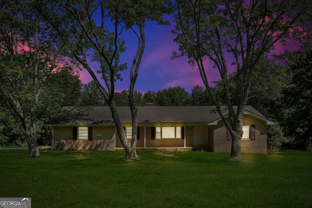 4911 Old Douglasville Rd, Lithia Springs, GA 30122 - ranch-style home with a front yard and brick siding