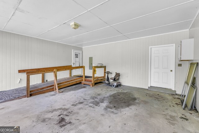 4911 Old Douglasville Rd, Lithia Springs, GA 30122 - garage featuring electric panel and wooden walls