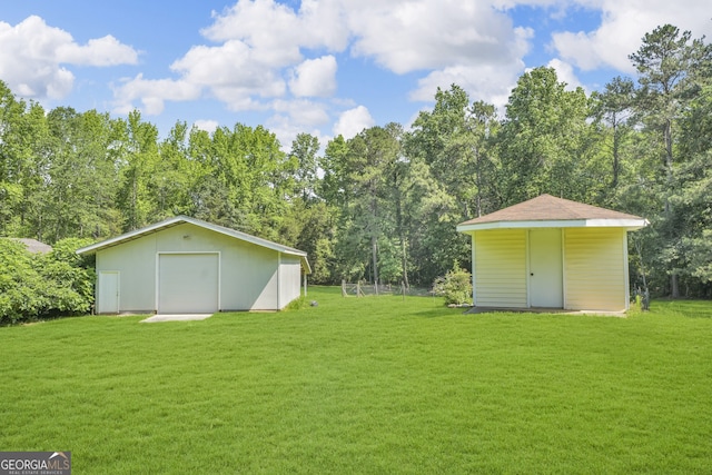 4911 Old Douglasville Rd, Lithia Springs, GA 30122 - view of green lawn featuring an outbuilding and a garage