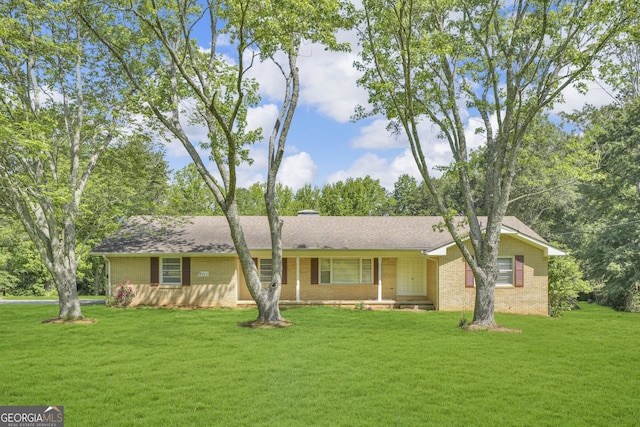 4911 Old Douglasville Rd, Lithia Springs, GA 30122 - ranch-style home featuring brick siding and a front lawn