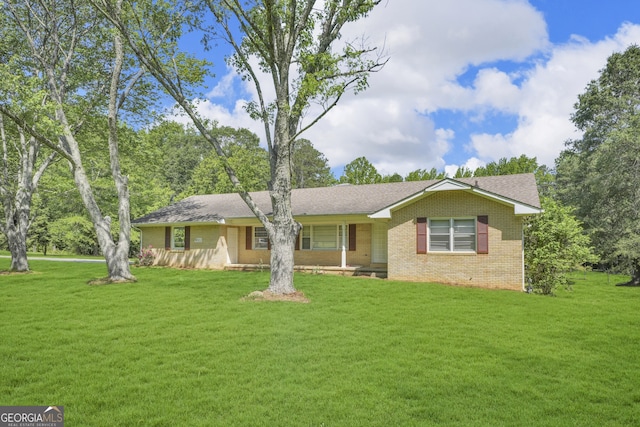 4911 Old Douglasville Rd, Lithia Springs, GA 30122 - ranch-style home with brick siding, a front lawn, covered porch, and roof with shingles
