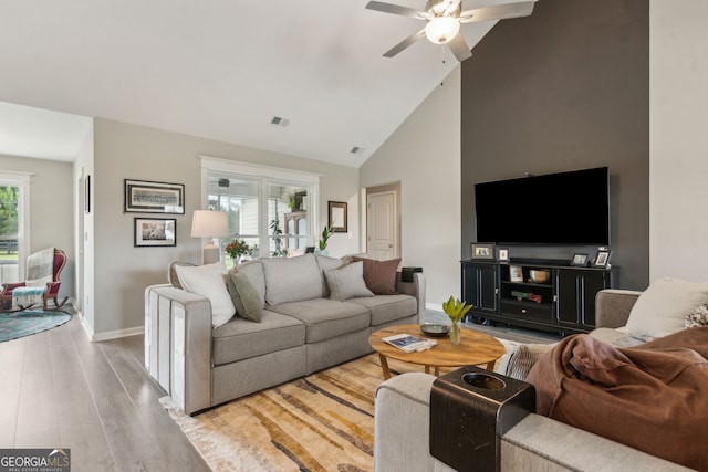 102 Bowline Ln, Kingsland, GA 31548 - living room featuring a ceiling fan, wood finished floors, baseboards, and high vaulted ceiling