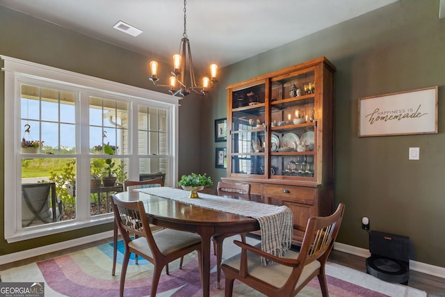 102 Bowline Ln, Kingsland, GA 31548 - dining space with a chandelier, plenty of natural light, baseboards, and wood finished floors