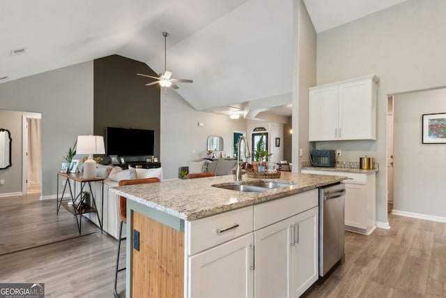 102 Bowline Ln, Kingsland, GA 31548 - kitchen with a sink, high vaulted ceiling, dishwasher, a ceiling fan, and a kitchen island with sink